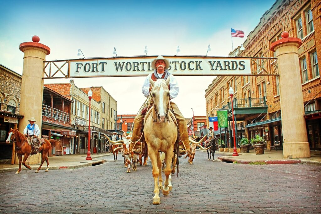 Cowboy on horse at fort worth stockyards. In Fort Worth Texas.